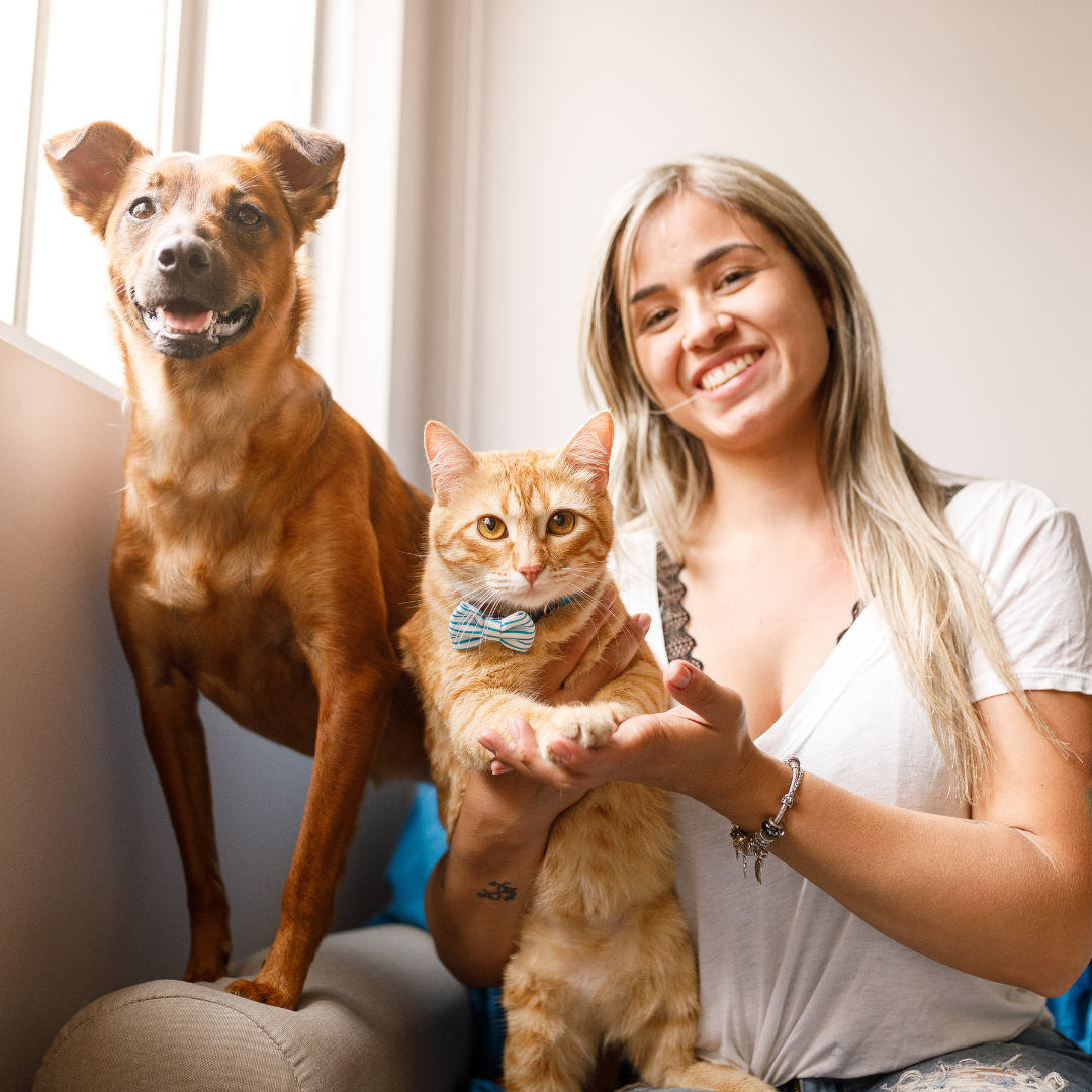 Pet owner with dog and cat